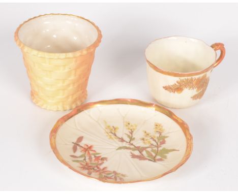 A Worcester porcelain cup and saucer, gilt decorated with floral sprays and a Royal Worcester ivory blush basket weave pot, R
