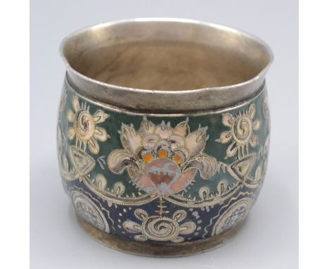 A Faberge silver gilt and cloisonne enamelled vodka cup in the manner of Feodor Ruckert and the Modern style. The cup is of b