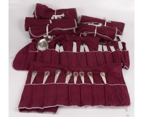 A silver plated shell pattern suite of cutlery, comprising of nine soup spoons, nine teaspoons, nine dessert knives, nine din