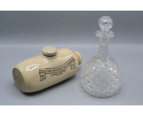 A mallet shaped cut glass decanter, 19th century, height 25cm and a Doultons Improved Foot Warmer, length 24cm. 