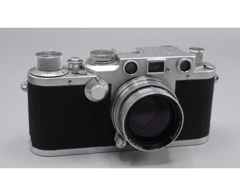 A Leica IIIc camera, no. 489783, Summitar f=5cm 1:2 No725876 lens, in original Leica brown leather case. (See illustration)  