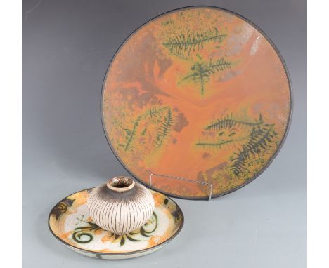 A Celtic pottery dish, diameter 26.5cm, a large studio pottery fern decorated charger, diameter 42.5cm and a pottery vase, in