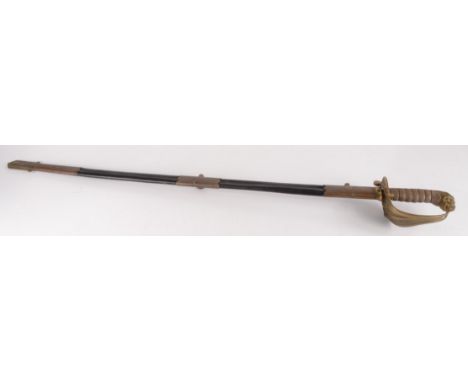 A officer's naval dress sword, the 79.5cm blade with royal cypher, wire bound black shagreen grip and hinged brass guard with