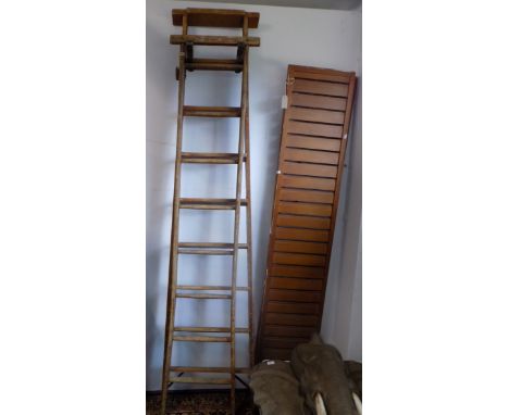 A stained ash and pine library ladder by Slingsby, mid 20th century, in two parts, each part with an oval white plastic label