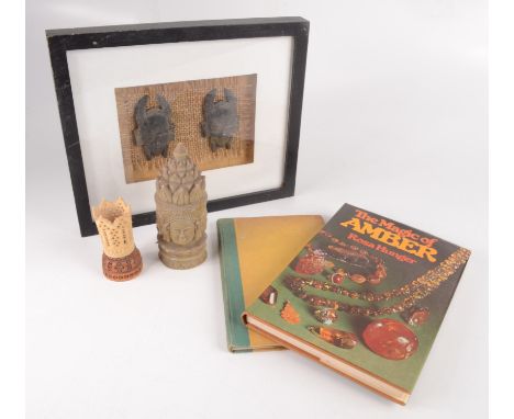 A framed pair of South East Asian pottery masks, frame size 22 x 26cm, an Indian bone dice shaker, height 7.5cm, a soapstone 