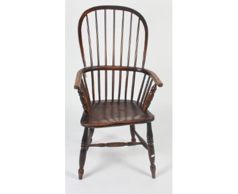 A high back Windsor armchair, 19th century, with a stick filled back, solid arms and seat on turned supports, height 103cm, w