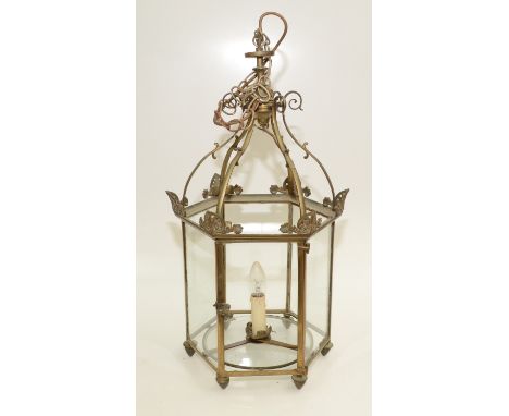 A brass hexagonal hanging lantern, early 20th century, height 63cm. Condition report: Glass panel in door is missing,  Glass 