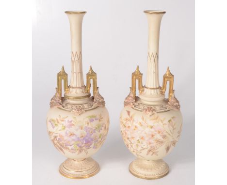 A pair of Royal Worcester blush ivory vases, each with a long tapering neck, the body painted with floral sprays, height 31cm