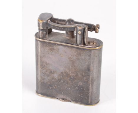 A silver plated Dunhill Unique petrol cigarette lighter, full height 5.3 cm, marked Made in England, PAT. No. 390107.