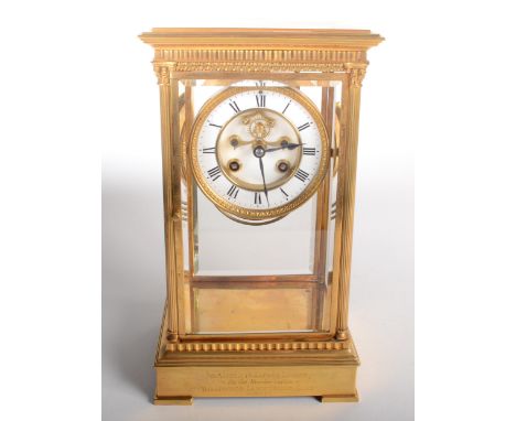 A good gilt brass four glass mantel clock, 19th century, the 9cm white enamelled dial with roman numerals flanked by corinthi