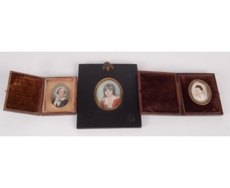 A miniature portrait of a lady by C Jabez Hughes, 4 x 3.2cm, original mount and case, together with two other portrait miniat