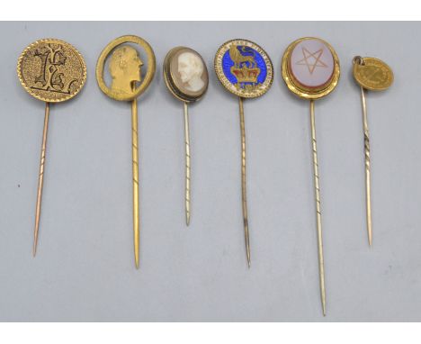 An American Indian head gold five dollar coin mounted as a stick pin the reverse now with an enamelled monogram, together wit