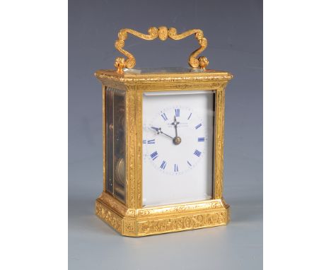 A fine French engraved gilt brass carriage clock by Paul Garnier no 1942, the white enamel dial signed PAUL GARNIER HER DU RO