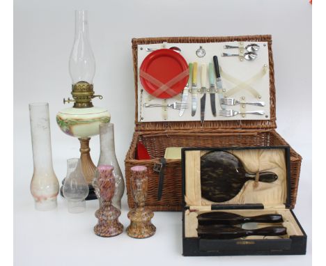 A wicker picnic basket and contents, inscribed beneath the lid 'Travel With Safety St. Christopher Regd', width 50.5cm, an oi