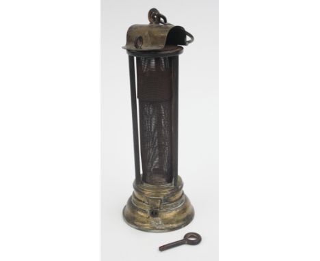 A brass and gauze Davy type miners lamp, the brass domed top with impressed initials E.C.C. in a triangle, circular stepped b