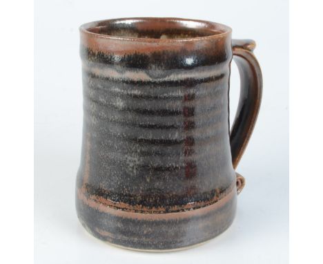 A Leach pottery tenmoku glazed mug, impressed mark to base, height 11.9cm. 