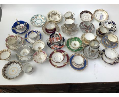 A selection of 18th and 19th century porcelain cups and saucers, including Coalport, Derby, Newhall, Worcester and Chinese Ca