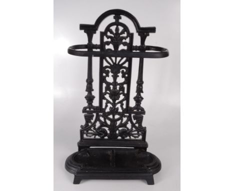 A cast iron black painted stick stand, height 53cm, width 33cm. 
