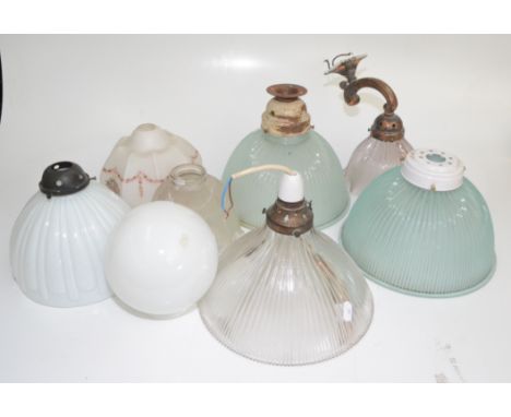 Eight glass lamp shades, diameter of largest 25.7cm. 