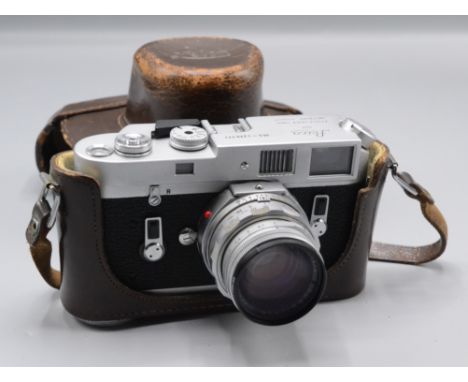 A Leica M4 camera no.1270771, with Summicron 1:2/50 No1751475 lens, in original Leica brown leather case.   Condition report: