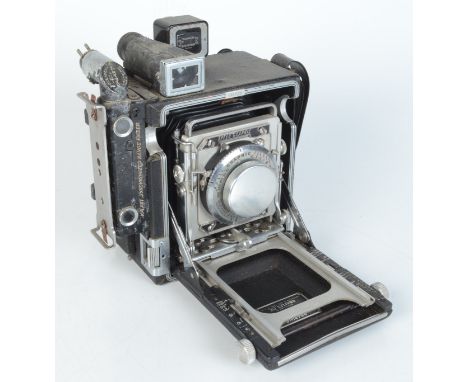 A Graflex Speed Graphic camera, with a 105mm Kodak Ektar lens.