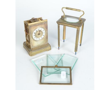 A brass carriage clock, 19th century, the circular white enamelled dial with arabic numerals, with striking mechanism, height