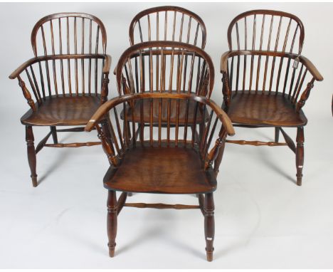 A set of four Windsor armchairs, 19th century, each with a stick filled back, solid arms and seat, on turned supports, height