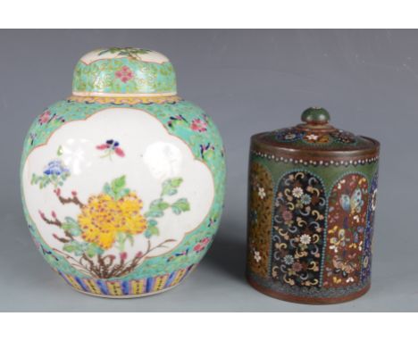 A Japanese cloisonne circular jar and cover, 19th century, decorated with vertical polychrome panels with an exotic bird and 