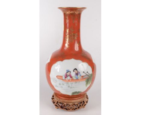 A Chinese Republican style porcelain globular bottle vase, supporting a cylindrical neck and trumpet mouth, the body decorate