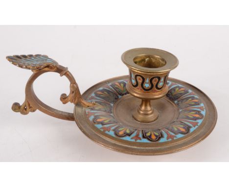 A European gilt metal and enamel chamberstick, early 20th century, height 6cm, width 15cm.