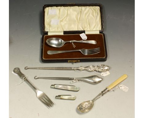A silver mother of pearl hafted fruit knife, Sheffield 1923; another, 1911; a silver christening spoon and fork, Birmingham 1