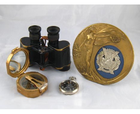 Militaria. A pair of W.D. binoculars, a W.D. pocket watch, a brass Stanley compass and a brass memorial photo frame with Toro