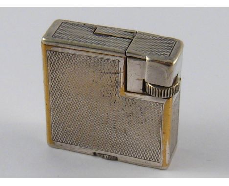 A silver plate Dunhill London cigarette lighter, made in Switzerland, approx 3.5 x 3.5cm.
