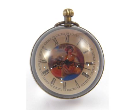 An anodised brass mounted glass ball button wind clock with central picture of a lady, the movement visible from the back. 