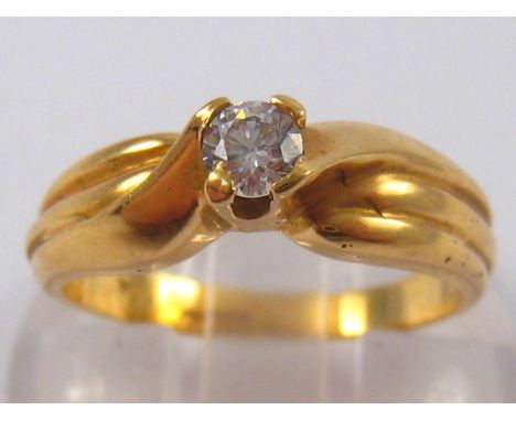 A yellow metal (tests 18 carat gold) cubic zirconia ring, size K ½, 4.3 gms.