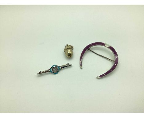 A Large Enamel Horseshoe Brooch, highlighted in purple, stamped "900"; together with a pearl and enamel bar brooch, highlight