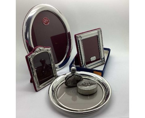 A Pewter Mounted Oval Photograph Frame, on plush easel back, overall height 22cm; together with two decorative Peweter mounte