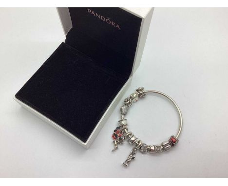 Pandora; A Modern Charm Bangle, with heart clasp with Christmas theme charms including Christmas tree, Santa, angel, reindeer
