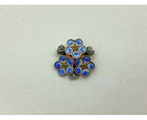 David Andersen; A Norwegian Gilt and Enamel Flower Head Brooch, highlighted in blue, white and green, stamped "David Andersen