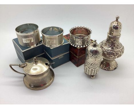 Three Hallmarked Silver Napkin Rings, boxed; together with two hallmarked silver pepperettes and a hallmarked silver lidded m