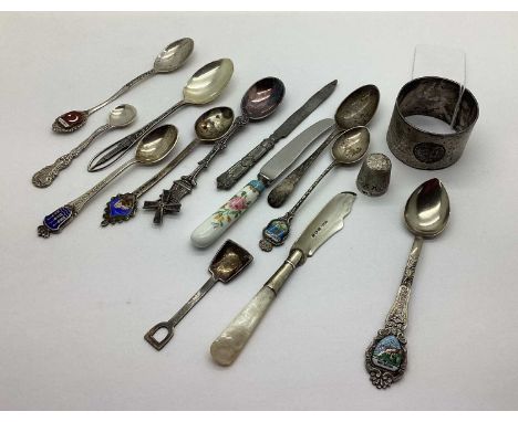 Hallmarked Silver and Mother of Pearl Butter Knife, souvenir and other spoons, including enamel highlights, a hallmarked silv