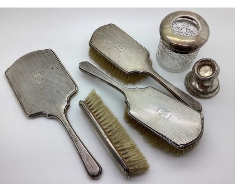 A Hallmarked Silver Backed Dressing Table Set, with engine tuned decoration; together with a hallmarked silver topped glass t