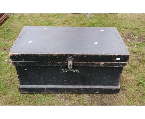 A Victorian pine trunk lined in mahogany with the name F Sanderson P M&nbsp; MED written on the front and a metal carrying ha