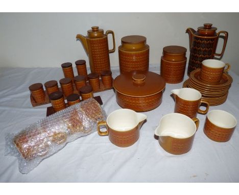 A Hornsea Saffron mid 1970's coffee set with 2 coffee pots, lidded biscuit barrel, cooking pot cruet sets, cream jugs, 5 cups