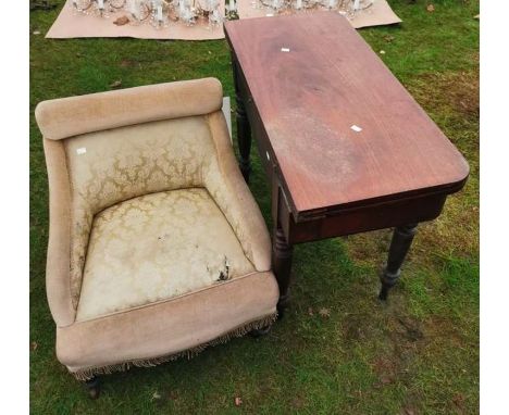 A Victorian mahogany fold out card table on four turned legs, together with an Edwardian upholstered nursing chair and a mode