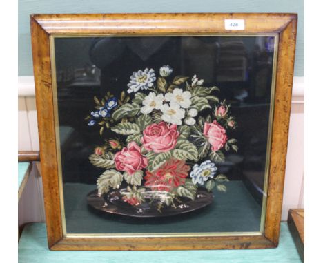 A tapestry of floral design in birds eye maple frame, 17" x 17"