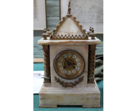 An onyx and gilt metal striking mantel clock