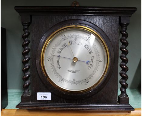 An oak aneroid barometer, dial marked Pastorelli &amp; Rapkin Ltd