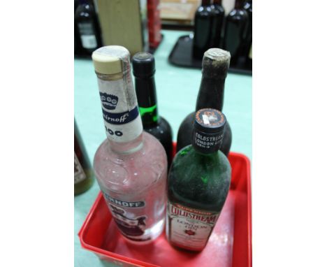 A bottle of Cockburns Special Reserve port, one other port (no label), Coldstream London gin plus Smirnoff vodka
