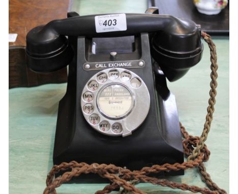 A vintage black Bakelite telephone plus a gilt framed print of a sea battle